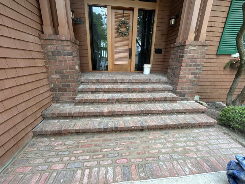 Dirty patio before pressure washing cleaning service in Grand Rapids, MI