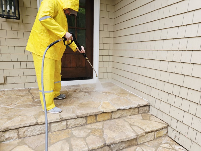 Professional pressure washing technician at work in Grand Rapids, MI