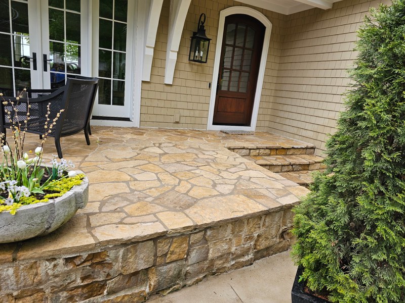 Clean stone patio after professional pressure washing in Grand Rapids, Michigan