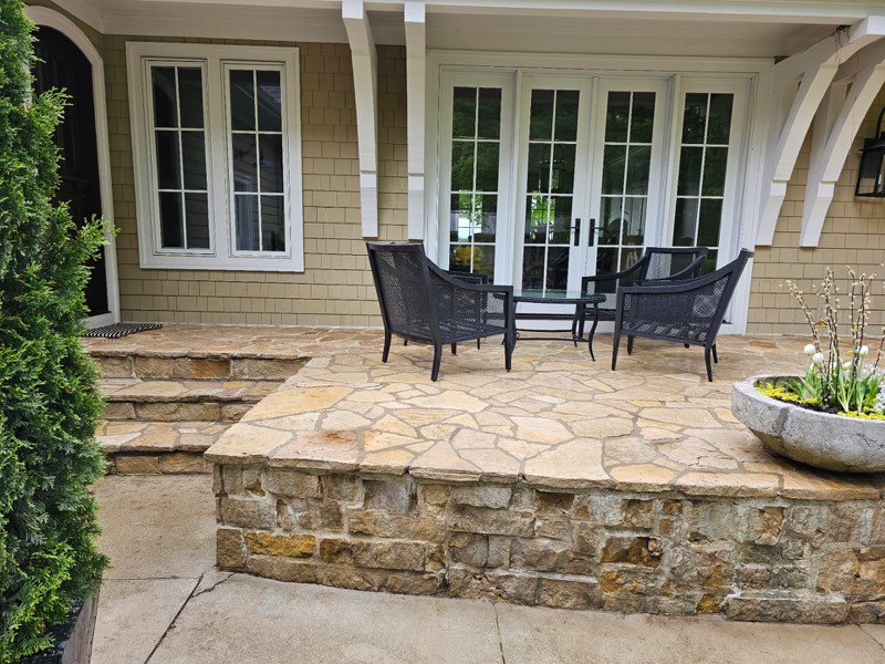 After: Stone patio cleaned by professional pressure washing service in Grand Rapids