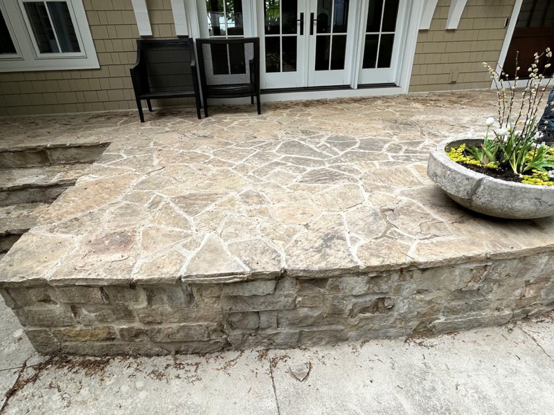 Before: Stone patio in Grand Rapids, MI before professional pressure washing